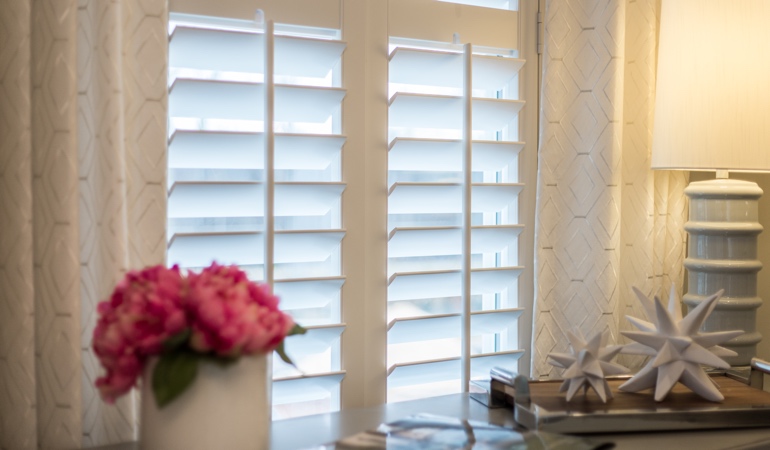 Plantation shutters by flowers in Atlanta